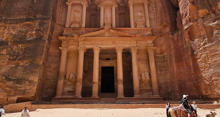 The Treasury in Petra, an iconic rock-cut temple with intricate carvings.