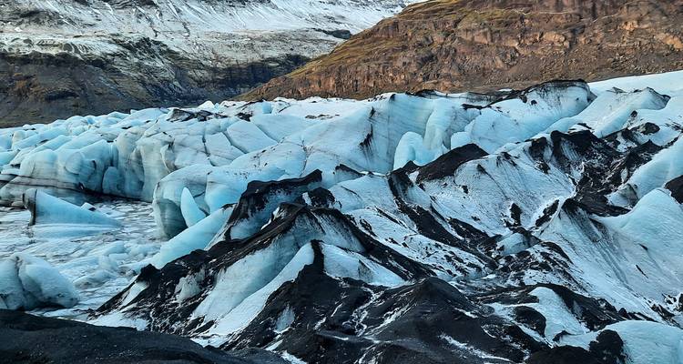 Ice and volcanic ash landscape of a glacier.