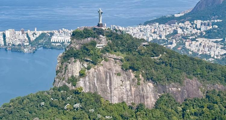 Aerial view of Christ the Redeemer statue overlooking the city and coastline.