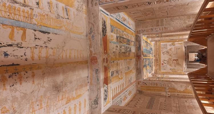 Interior of an ancient Egyptian temple with hieroglyphs on the walls.