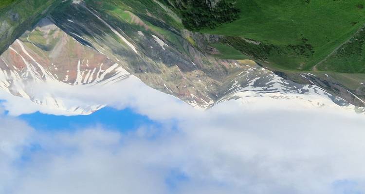 Snow-capped mountains under a clear blue sky.