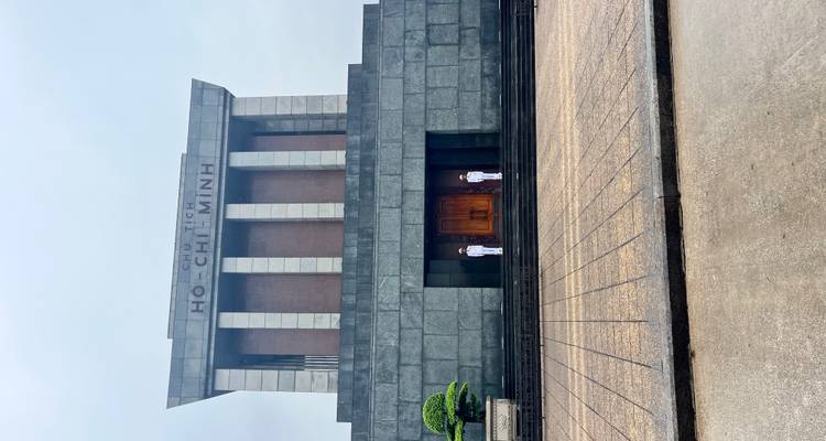 Ho Chi Minh Mausoleum with guards standing outside.
