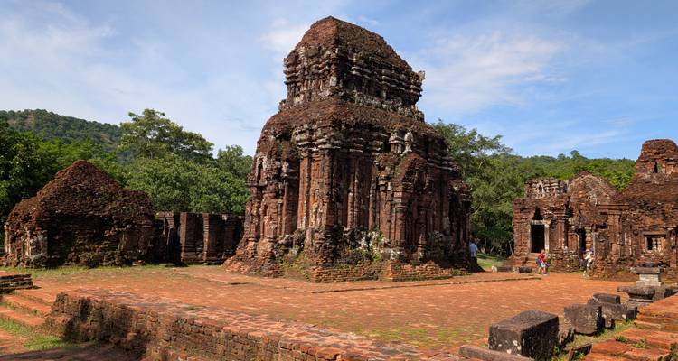 Ancient ruins and visitors in My Son Sanctuary.
