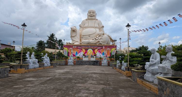 Large Buddha statue and decorative surroundings.