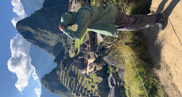 Person overlooking Machu Picchu from a vantage point.