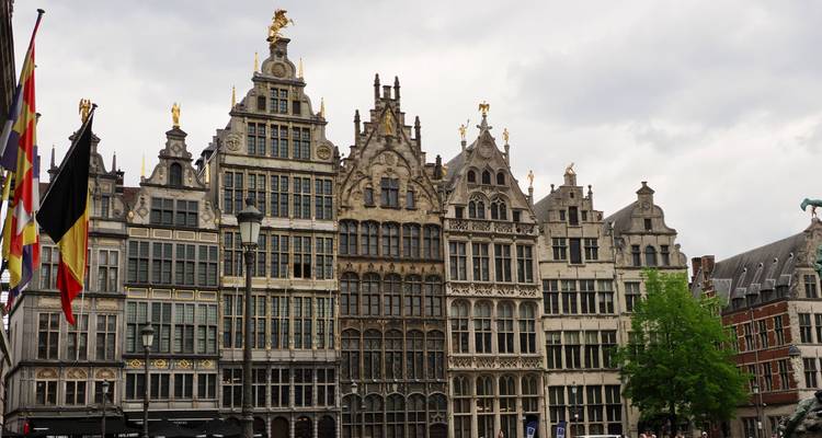 Ornate historic buildings in a European city square.