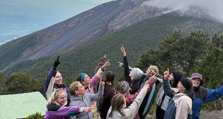 Excited group pointing towards the peak of Acatenango Volcano.