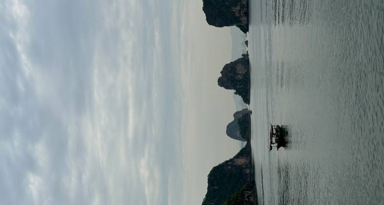 A scenic view of Halong Bay with limestone karsts.