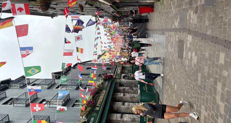 Colorful street decorated with international flags.