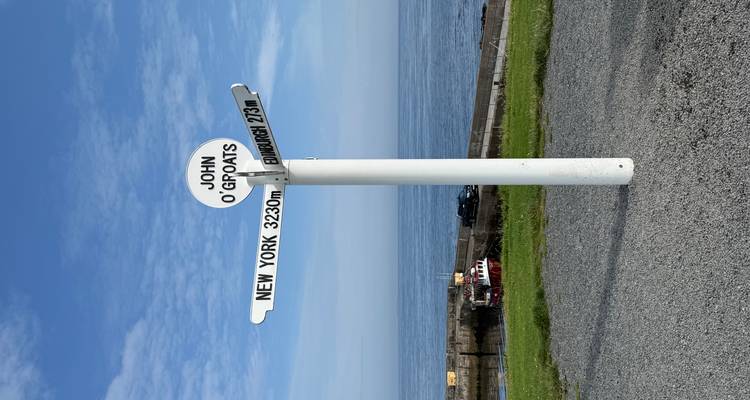 Signpost marking distances to various locations at John O'Groats.