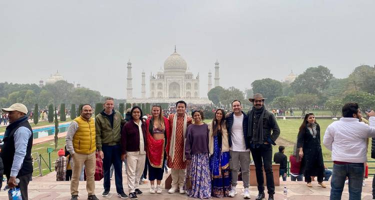 Group of people in front of the Taj Mahal.