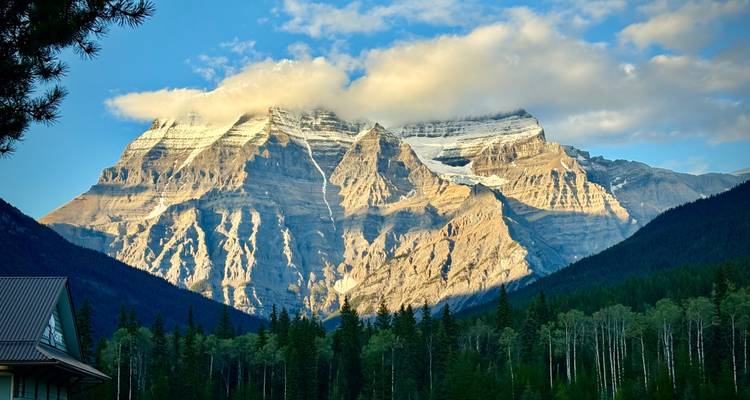 Mount Robson in the Canadian Rockies under clouds.
