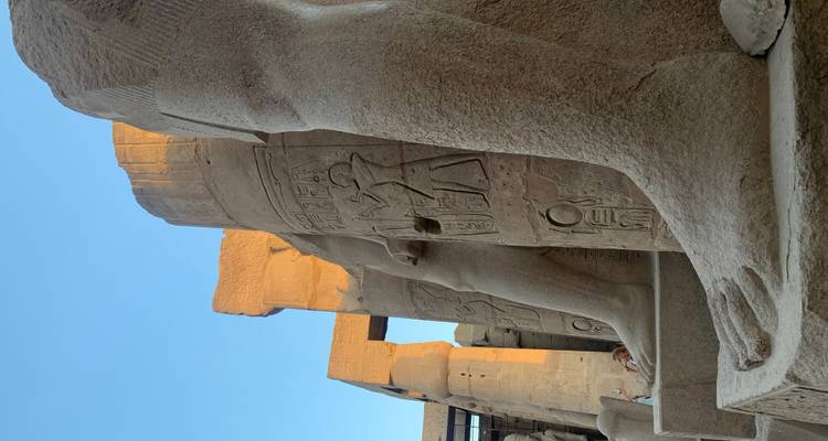 Close-up of ancient stone statues at a temple.