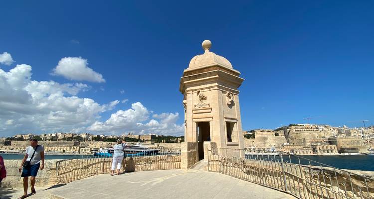 Stone guard tower overlooking the sea with scenic views.