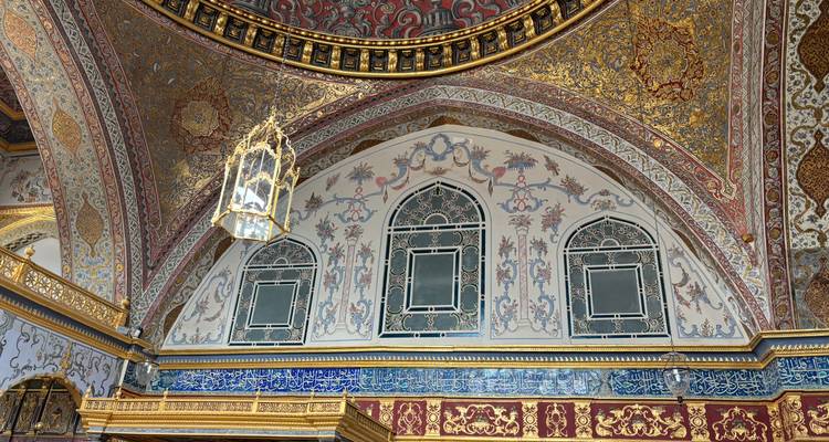 Close up of ornate interior decoration with gold and blue designs.