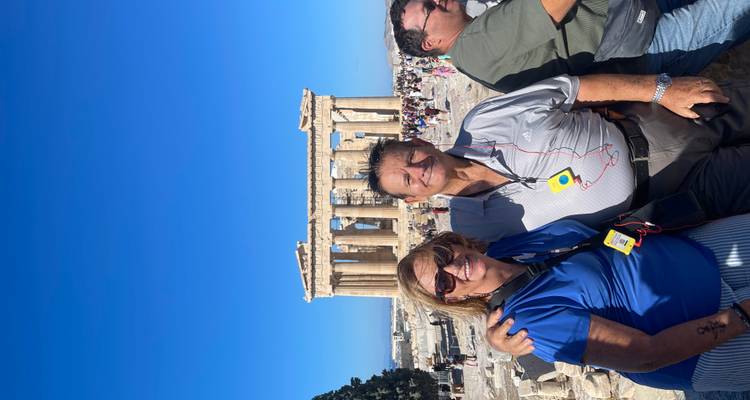 Couple posing in front of the Parthenon in Athens, Greece.