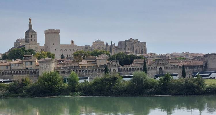 Historic cityscape with palatial buildings and a river.