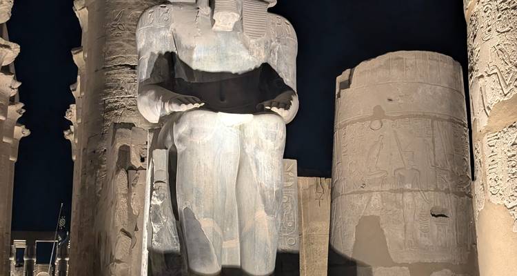 Statue of an ancient Egyptian pharaoh at night.