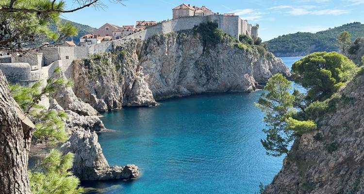 Scenic view of Dubrovnik's old city walls and coastline.