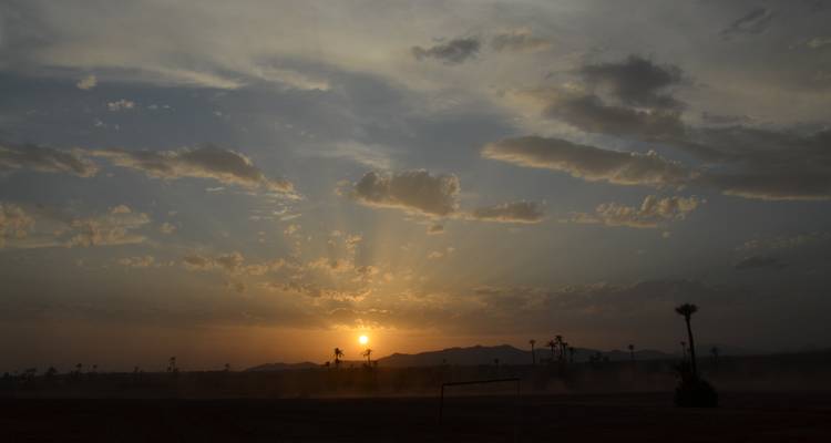 Sunset over a desert landscape.