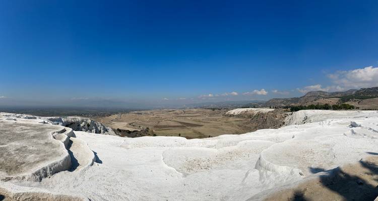 White terraces with a panoramic view of the landscape.