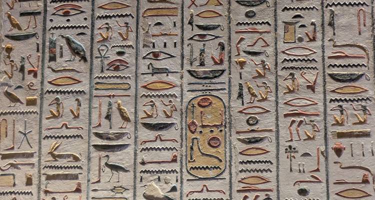 Detailed hieroglyphic carvings on an ancient wall.