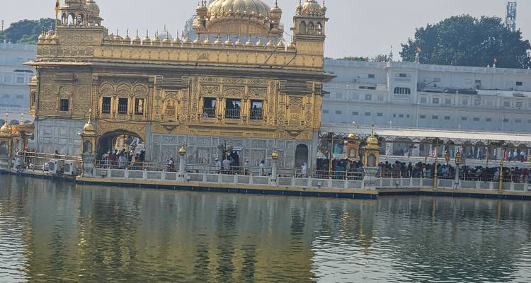 Golden Temple surrounded by a holy pool and visitors.
