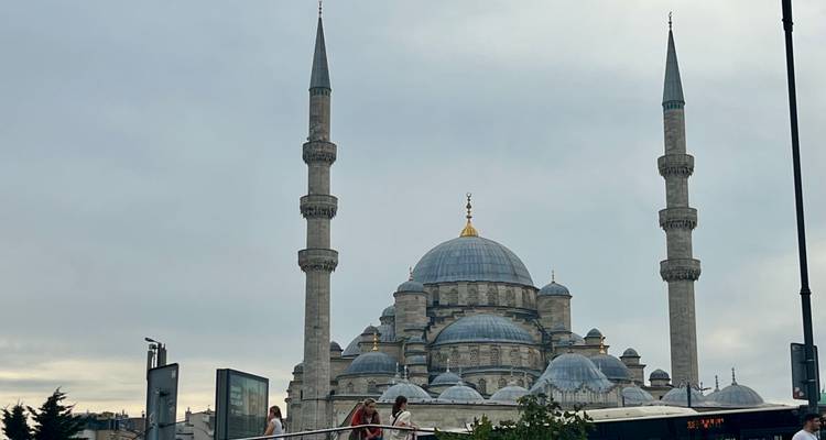 Mosque with multiple domes and minarets.