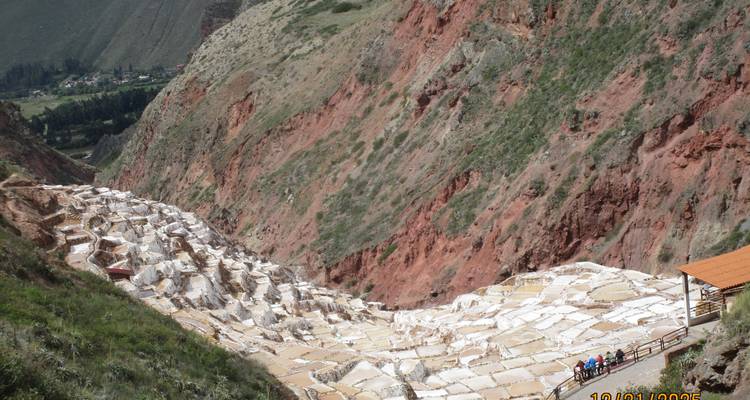 Terraced salt ponds in a red rocky landscape.