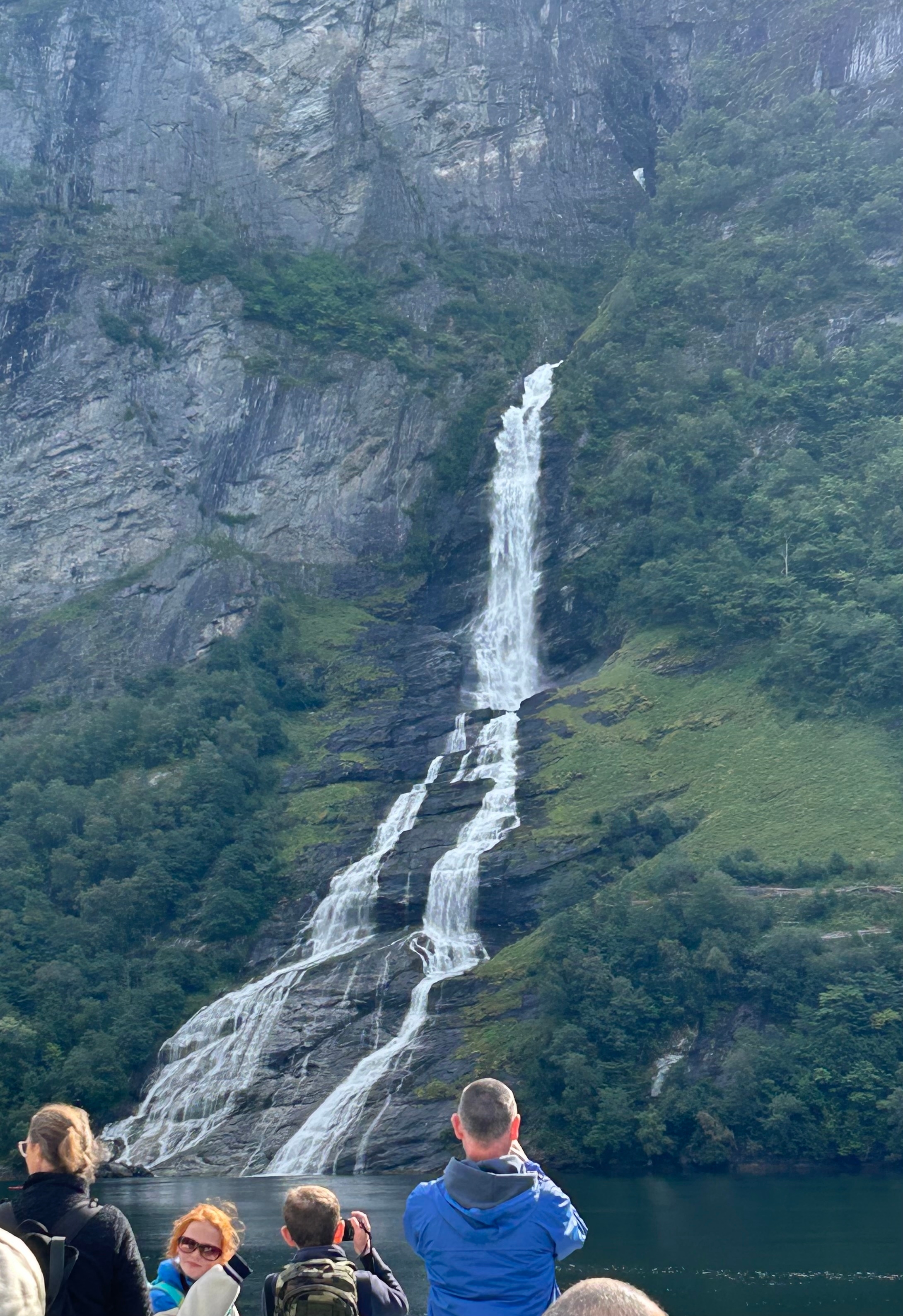 Tall waterfall cascading down a cliffside.
