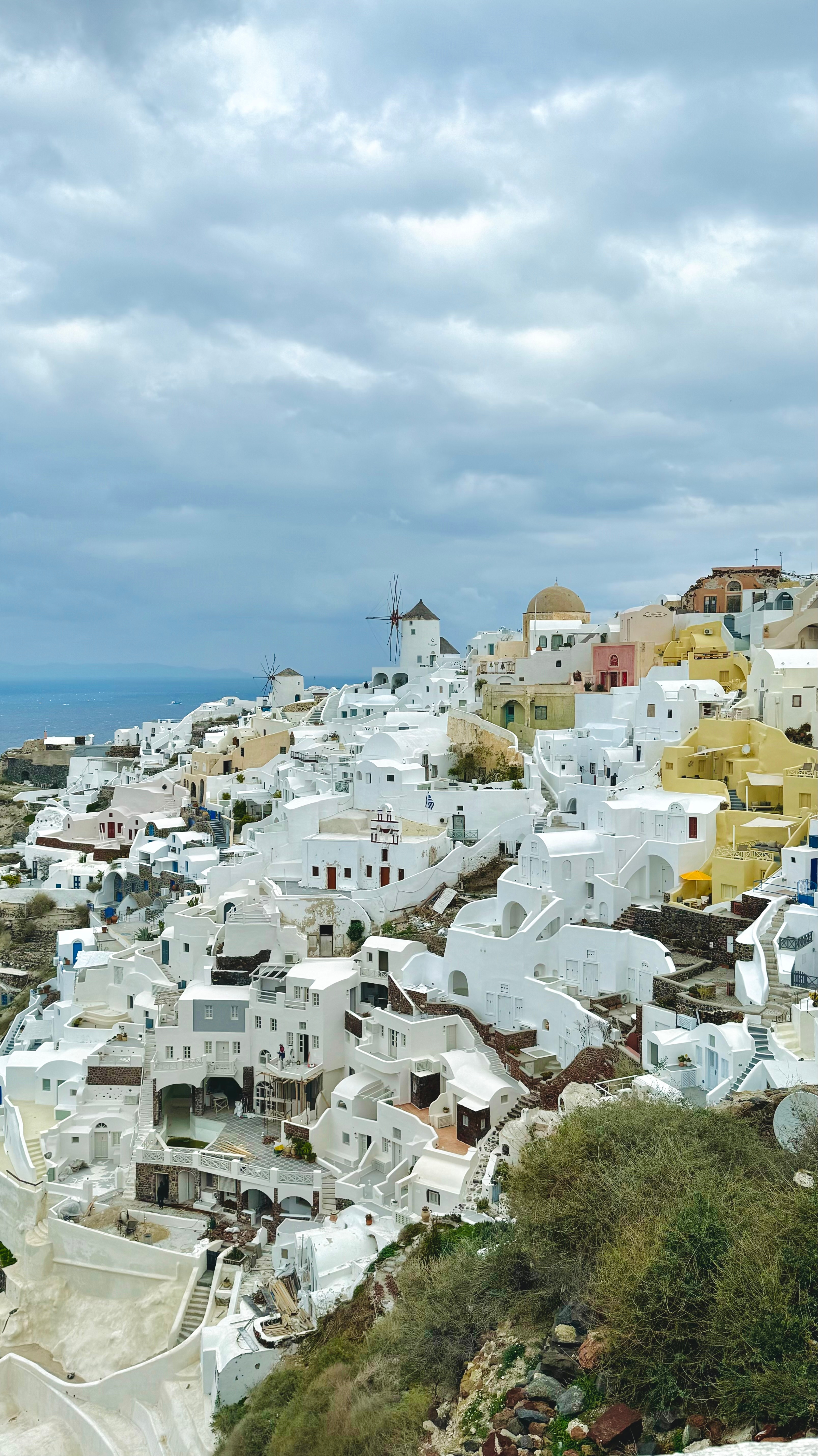 Scenic view of whitewashed buildings perched on a hill.