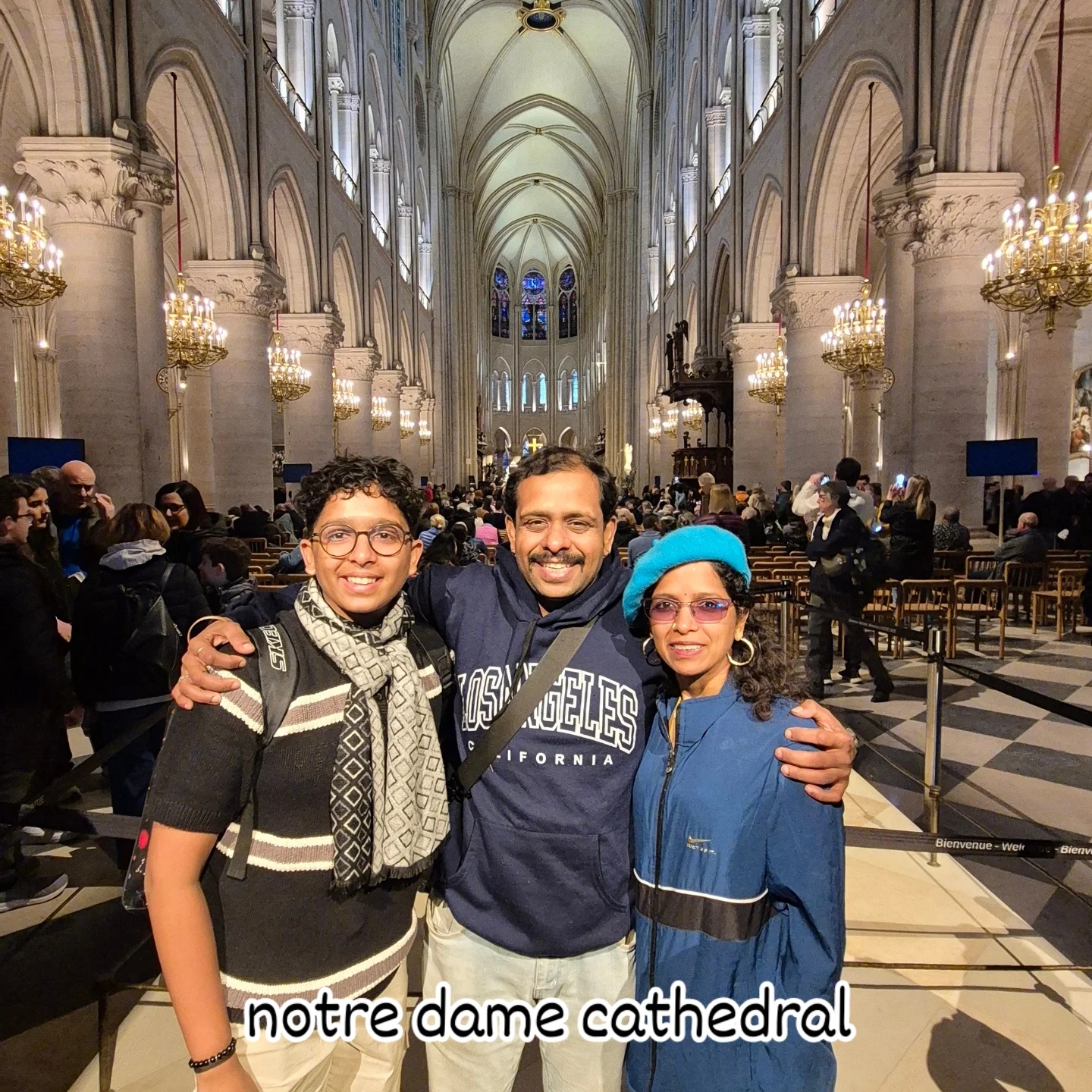 Family poses inside a grand cathedral with gothic architecture.