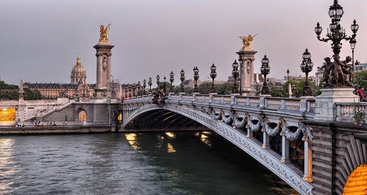Pont Alexandre III bridge in Paris at sunset.