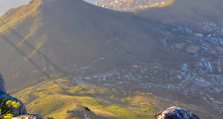 Scala line showing a bird's-eye view of city nestled between mountains.