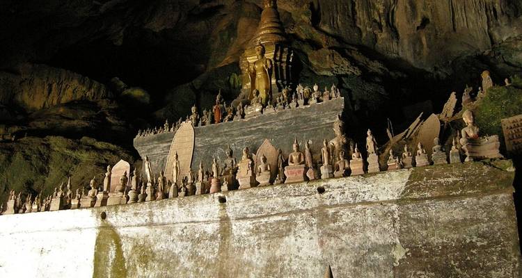 A cave filled with Buddhist statues.