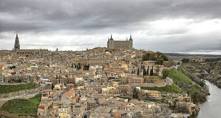 Panoramic view of a historic city with a large cathedral.