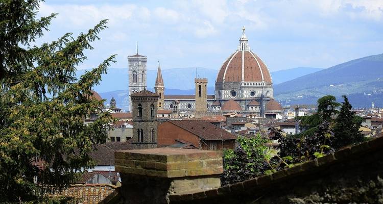 Distant view of Florence's Duomo and surrounding cityscape.