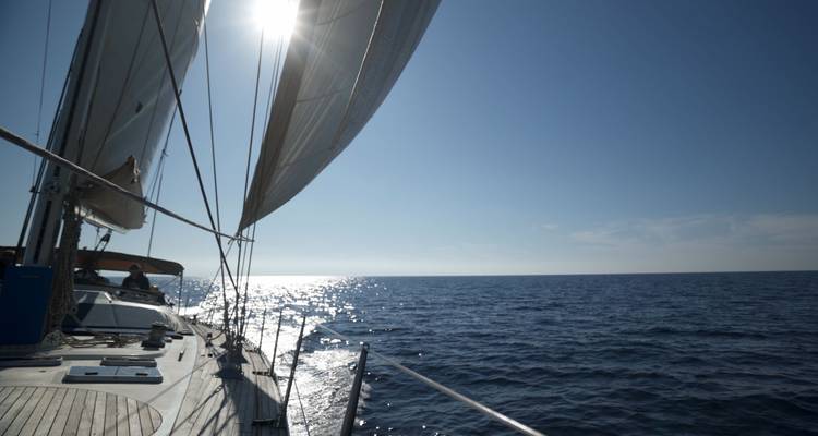 View from the deck of a yacht sailing on the open sea.