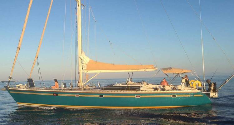 Sailing yacht in the sea with a clear blue sky.