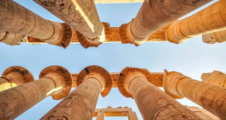 View of ancient columns looking up to the sky.