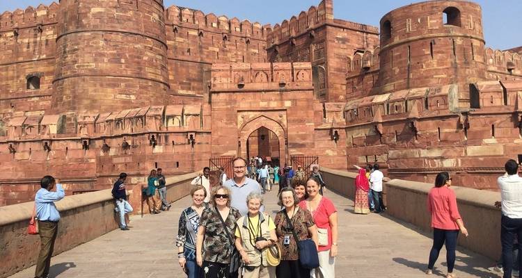 A group of tourists in front of the Red Fort in Agra.