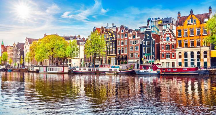 Houseboats and traditional houses along Amsterdam's canals.
