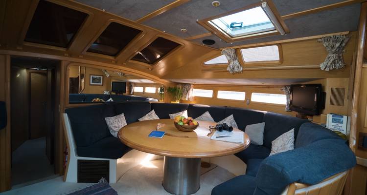 Interior of a yacht with a dining area and decor.
