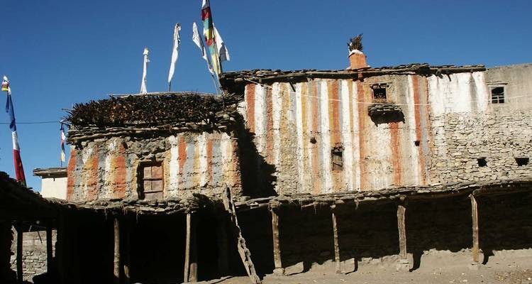 Traditional building with colorful flags.