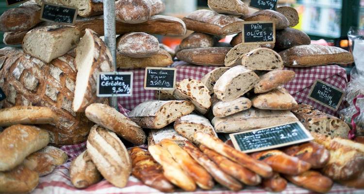Variety of breads on display at a market.
