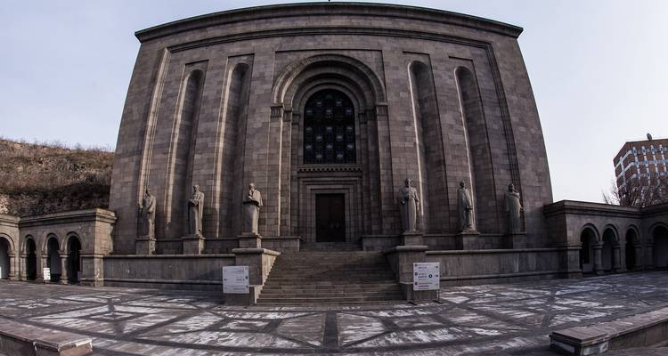 Large historical building with arched windows.