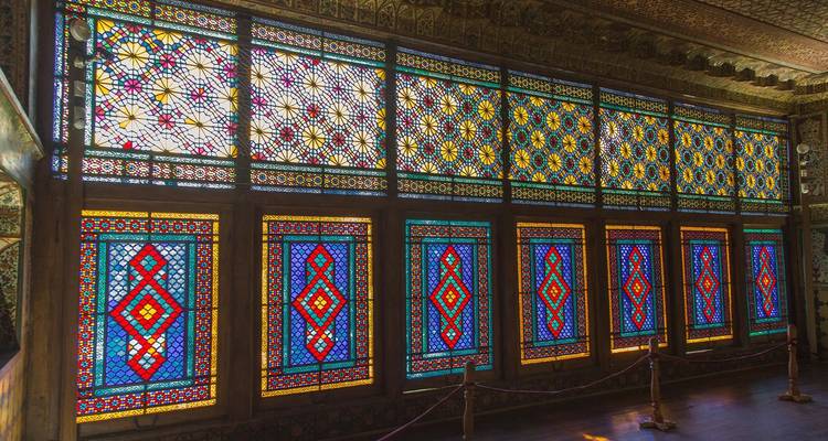 Intricate stained glass windows in a historical setting.