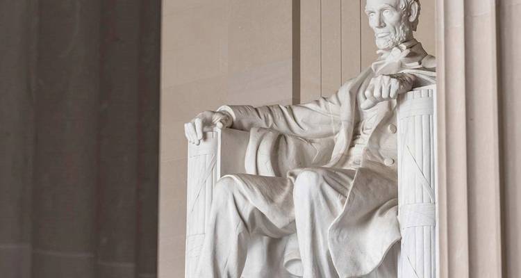 The marble statue of Abraham Lincoln sits solemnly within Washington’s Lincoln Memorial