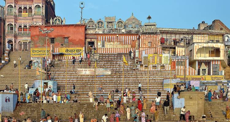 Busy ghats with people engaging in daily activities.