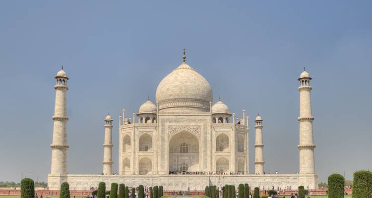 Taj Mahal from a distance with visitors.